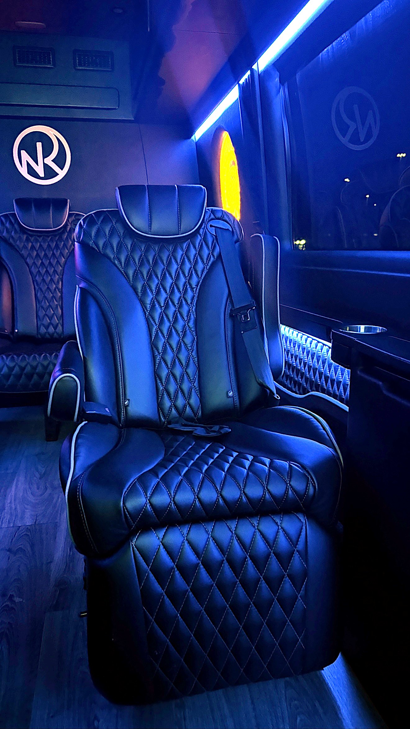 Diamond-stitched leather captain chair with leg rest inside the Jet Sprinter